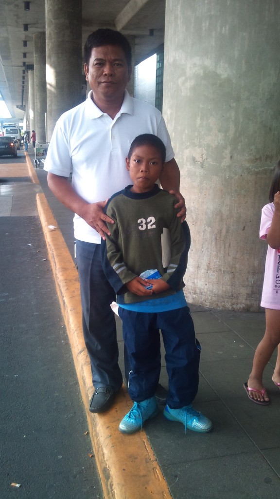 Jamer at the airport with Pastor Roy