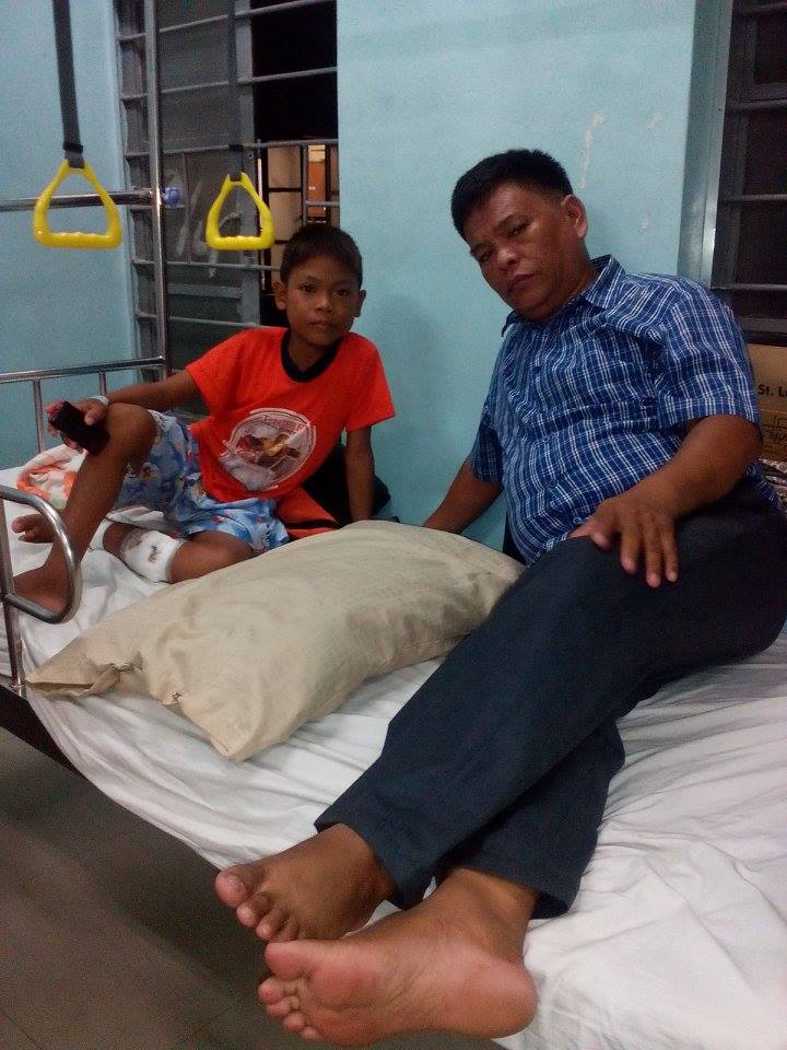Jemar and Pastor Roy Malpas in the hospital